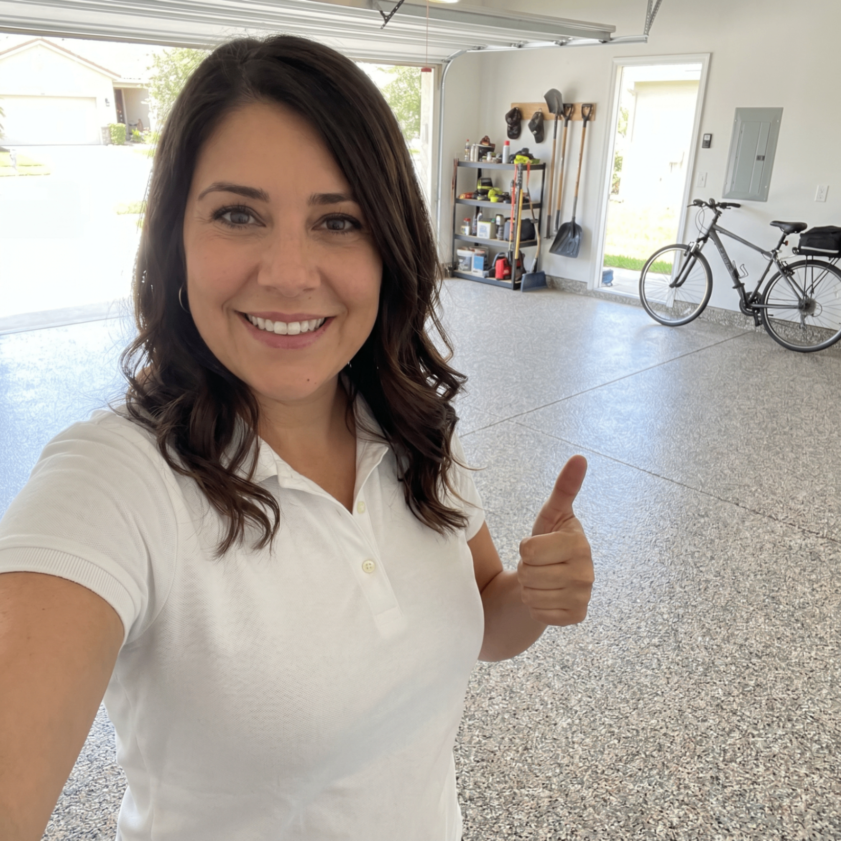 Olivia standing on a finished garage floor